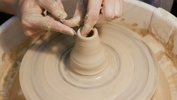 Man's Hands Making Clay Ware on the Potter's Wheel