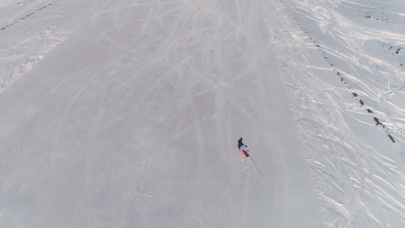 Flying Over The Snowboarder