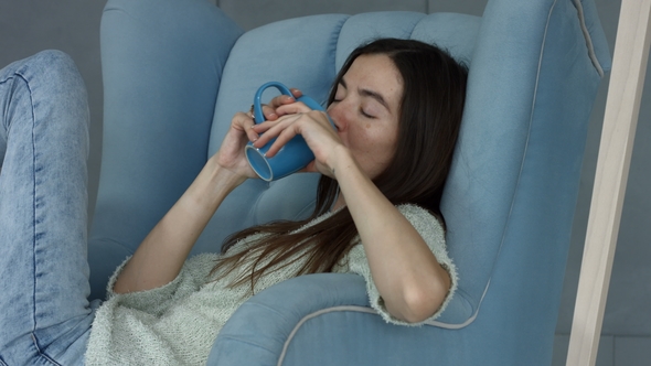 Lovely Casual Woman Enjoying Fresh Coffee at Home