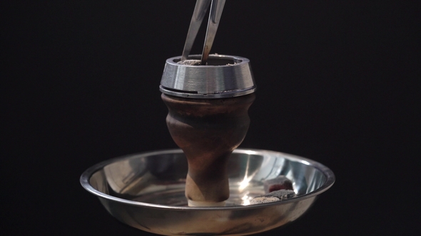 Man Preparing Hookah Bowl for Smoking