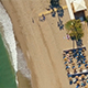 Drone Footage of Beach, Sea Waves, Beach Clubs, Promenade, Palms during Sunset - VideoHive Item for Sale