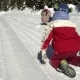 Two Happy Beautiful Children Have Fun Sleigh Rides in a Snow-covered Forest in the Mountains - VideoHive Item for Sale