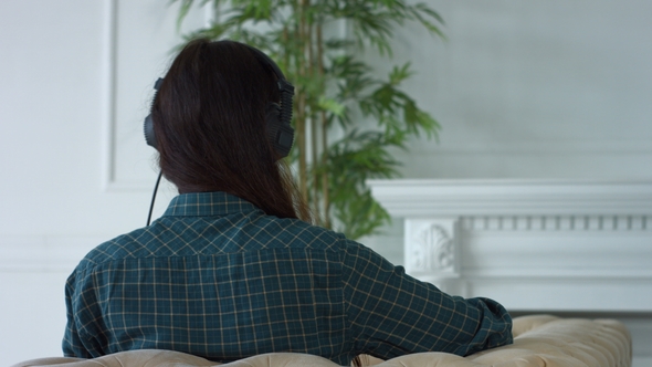 Happy Woman in Headphones Listening To MP3 Player