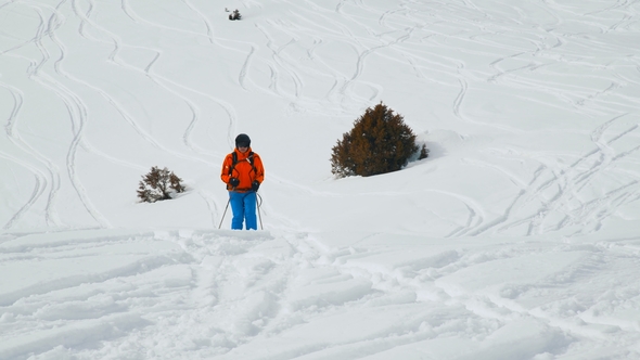 Amazing View of a Snow Capped Hill with Skier Riding Downhill