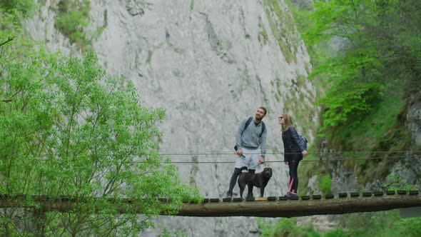 Couple admiring the view from a bridge