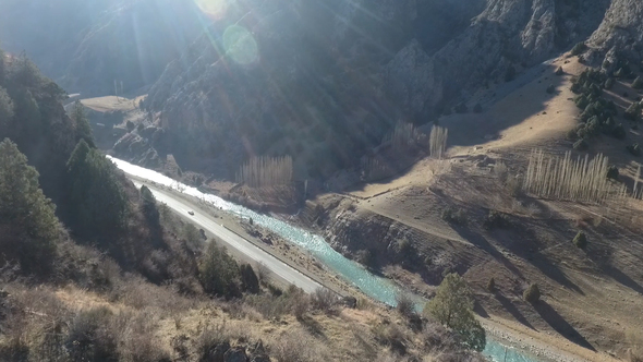 Car on an Asphalt Road in the Mountains