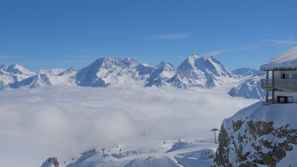 Breathtaking Panorama From Right To Left of Snowy Mountains And Clouds Valley