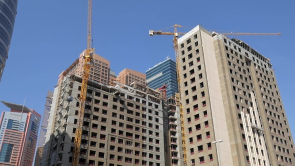 Huge Cranes Are Moving and Transferring Construction Material for Constructing Multifloor Houses