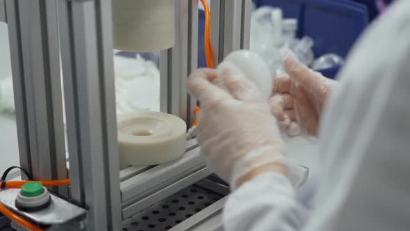 Production of Medical and Oxygen Breathing Masks, Woman at Work, the Process of Assembling a Filter