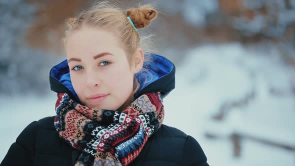 Portrait of Cute Blue-Eyed Young Woman