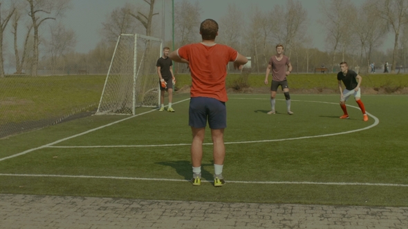 Soccer Player Throwing the Ball in Onto the Pitch