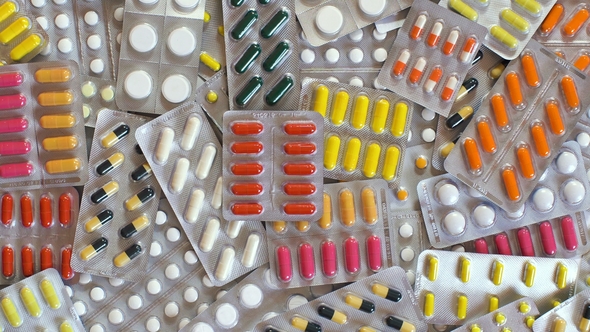 Antibiotic and Pills Taking Hand.
