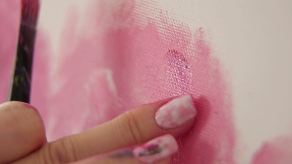 Girl Draws a Finger on the Canvas. Art