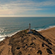 Aerial View of Lighthouse on the Coast during Sunset  - VideoHive Item for Sale