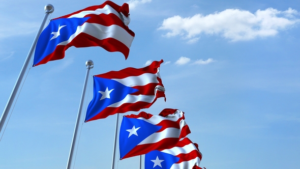 Waving Flags of Puerto Rico Against the Sky