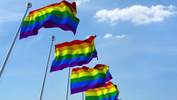 Waving LGBT Pride Flags Against the Sky