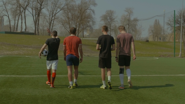 Sports Team Going To Football Training in the Pitch