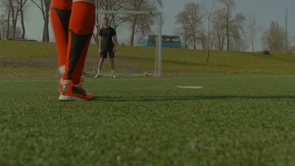 Soccer Player Taking a Penalty Kick During Game