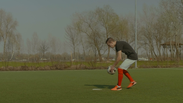 Handsome Soccer Player Taking a Penalty Kick