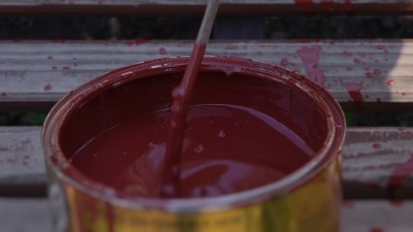 Stirring the Red Paint in the Jar, Mixing Paint in a Bank Stick,