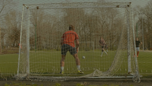 Striker Scoring a Goal After Penalty Kick