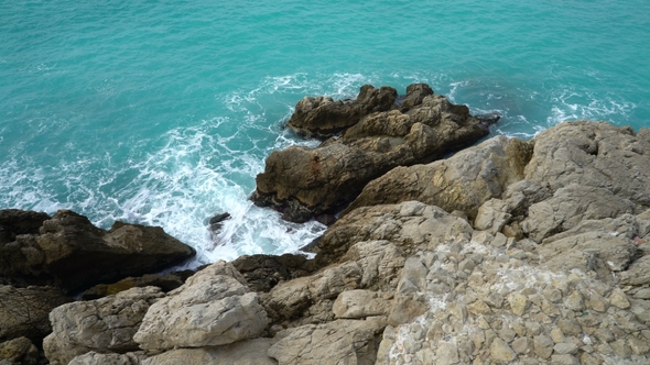 Waves Break on the Coastal Cliffs