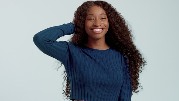 Beauty Black Mixed Race African American Woman with Long Curly Hair and Perfect Smile