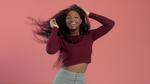 Beauty Black Mixed Race African American Woman with Long Curly Hair and Perfect Smile