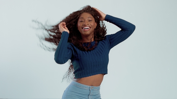 Beauty Black Mixed Race African American Woman with Long Curly Hair and Perfect Smile