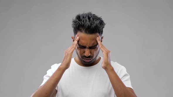 Unhappy Indian Man Suffering From Headache 3