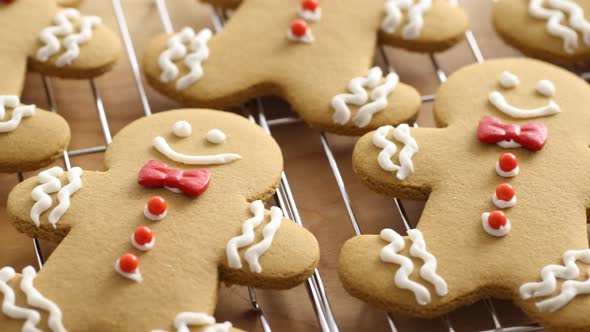 Closeup of homemade gingerbread cookies on cooling racks alt