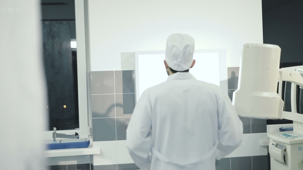 Doctor Observing Brain MRI Diagnostic in Hospital