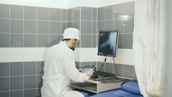 A Doctor Who Watches an MRI Examination and an X-ray of the Patient