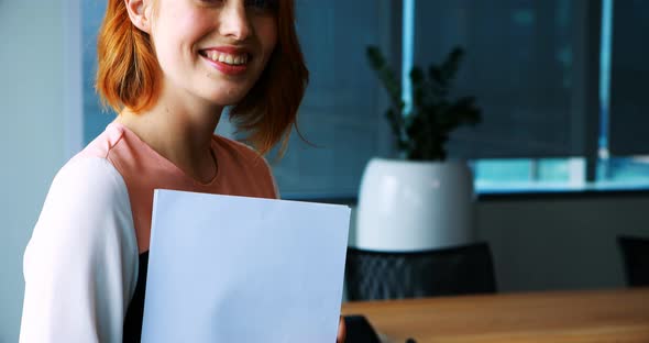 Confident female executive in office