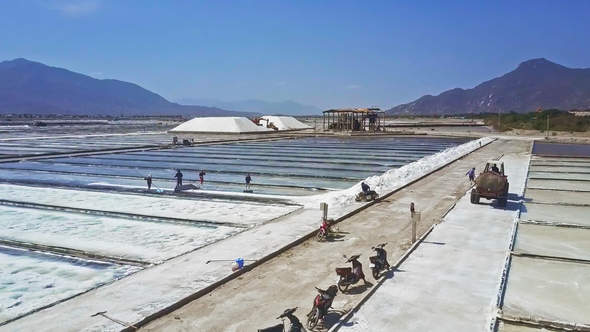 Asian People Collect Salt Using Traditional Method