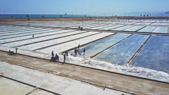 Drone Moves to Farmers Draining Water after Raking Salt