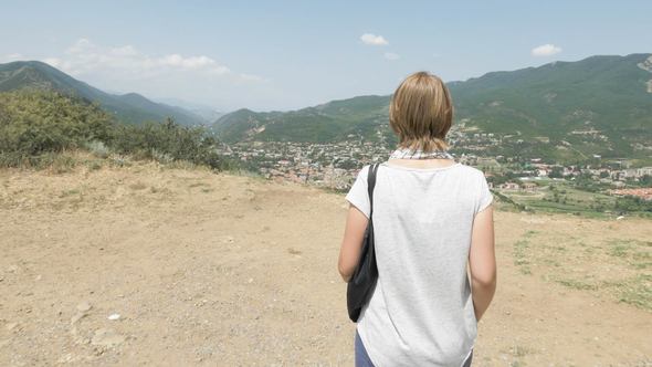 Girl Walks and Looks at Mtskheta from Jvari Area in Georgia