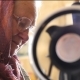 A Woman in Glasses Sews on the Sewing Machine - VideoHive Item for Sale