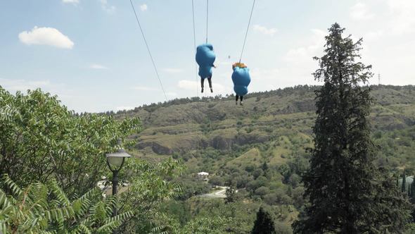 Two People Taking Zipline Ride at Tbilisi in Georgia