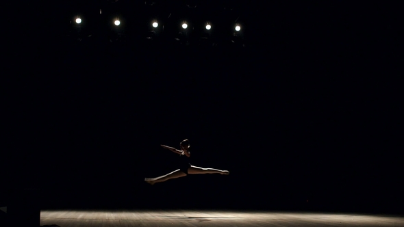 Girl Ballerina Doing Horizontal Twine on Stage.