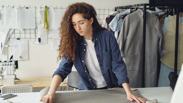 Female Tailor Is Rolling Out Fabric Bolt 