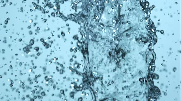 Water pouring and splashing in ultra slow motion 1500fps on a reflective surface - WATER POURS alt