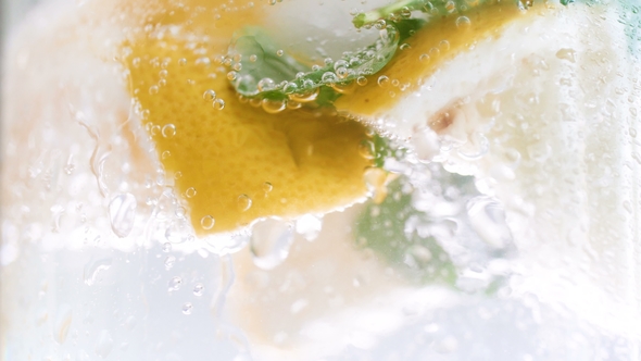 Video of Misted Cold Glass of Sparkling Lemonade with Mint