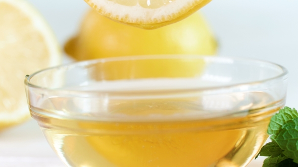 Footage of Lemon Slice Putting in Jar with Honey