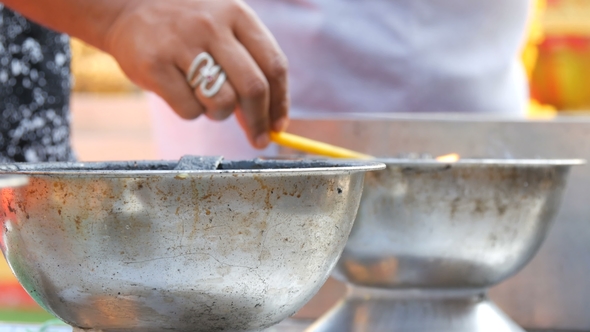 People Light Scented Wands of Good Luck and Wax Candles From Bowl of Living Fire. Buddhist Religion.