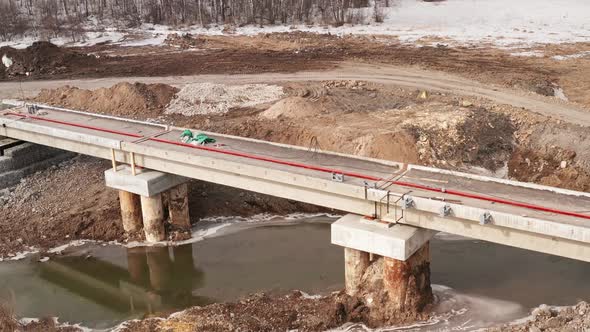 Construction of Railway Bridge Over River in the Countryside. Building of the Bridge, in the Spring