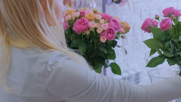 Professional Florist Making Floral Composition at Flower Shop