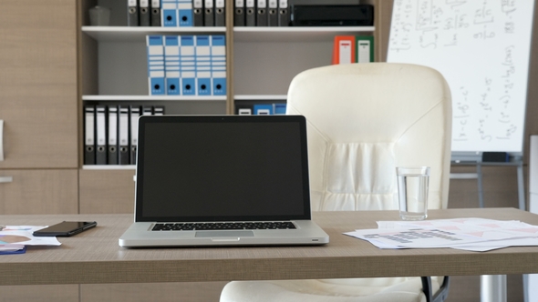 Modern Laptop in Empty Office on a Desk