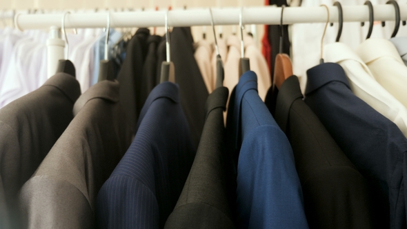 Business Suits, Shirts and T-shirts on a Hanger