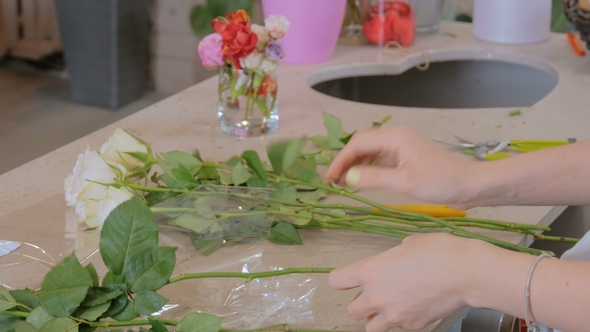 Professional Floral Artist Working with Flowers at Studio